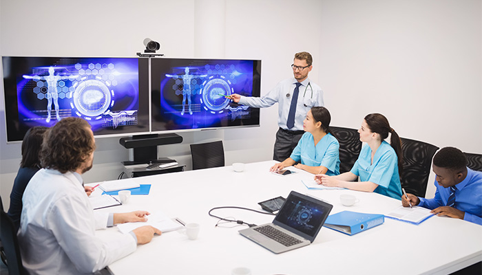 group of staff discussing software in conference room